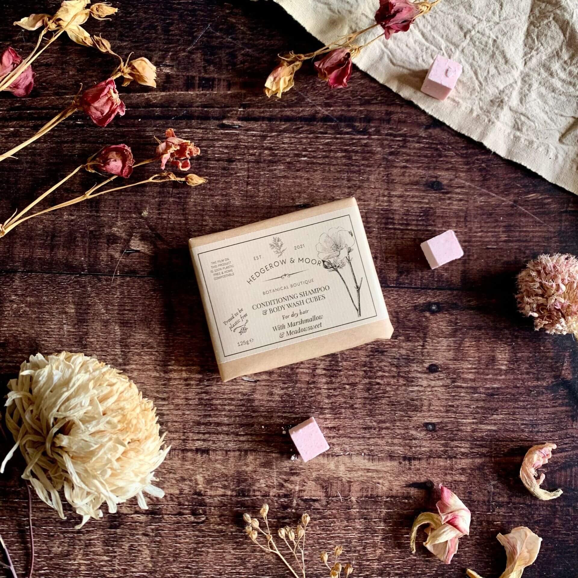 Close-up of a single Conditioning Shampoo & Body Wash Cube showing smooth, creamy texture — natural vegan cleansing cube for hair and skin by Hedgerow & Moor.