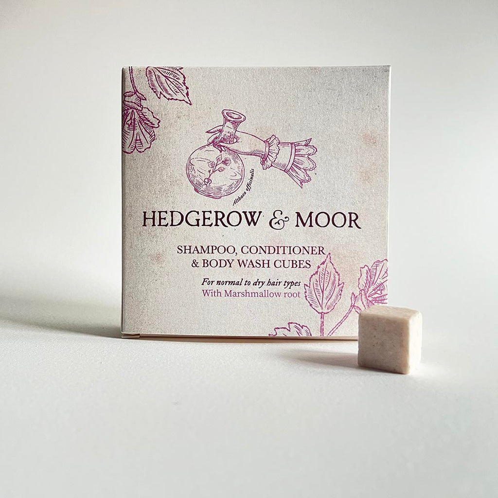 Box of Hedgerow & Moor plastic free shampoo, conditioner, and body wash cubes on a light background