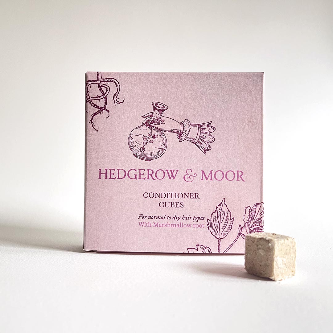 Box of plastic free Hedgerow & Moor conditioner cubes on a white background
