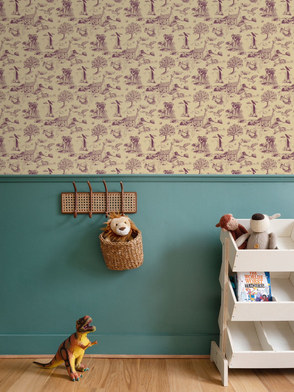 An interior scene showing a stylish hedgerow and Moor Toile du Jouy patterned wallpaper with Cornish countryside vignettes