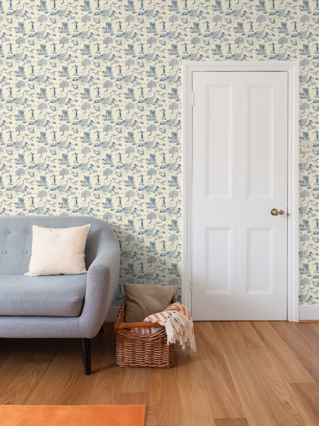 Traditional blue and warm ivory Cornish toile wallpaper with a stone farmhouse, fox, barn owl, ravens, swallows, trees and detailed moorland scenes.