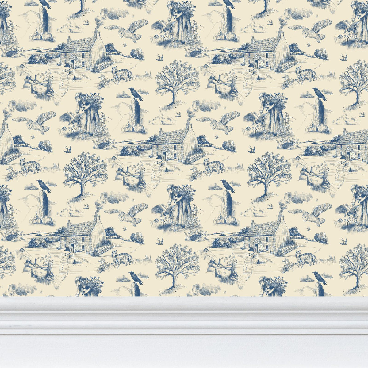 Blue and cream Hedgerow and Moor  toile pattern wallpaper with a repeating French countryside scene featuring trees, houses, birds, and animals, shown above a white baseboard.