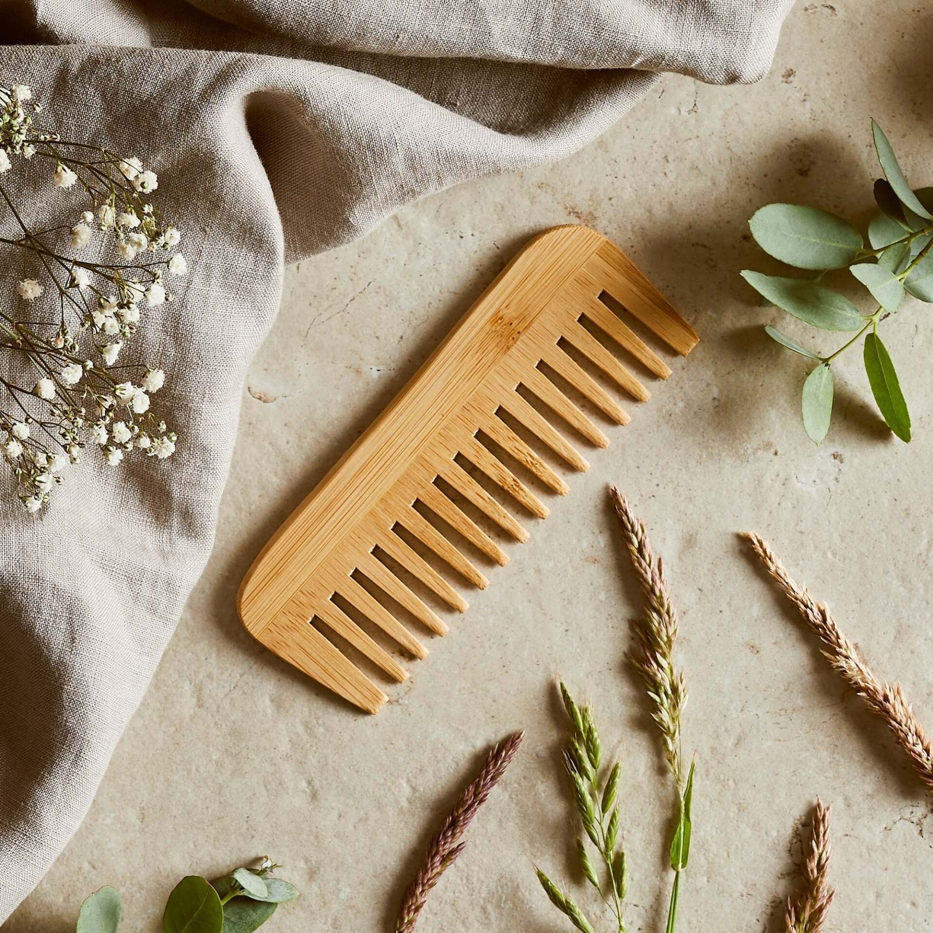 Natural bamboo comb by Hedgerow & Moor — eco-friendly plastic-free hair comb resting on neutral background ideal for sensitive scalps