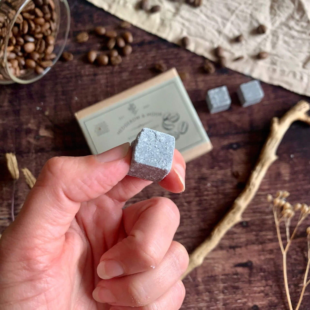 Close-up of Hedgerow & Moor charcoal shampoo cube for men — vegan, sulphate-free 2-in-1 hair and body cleanser.