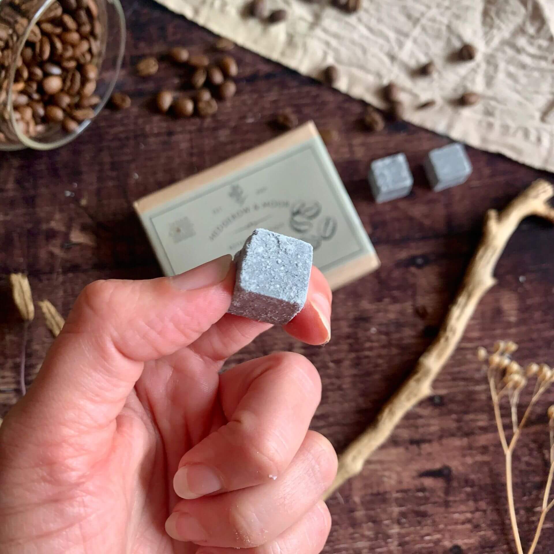 Close-up of Hedgerow & Moor charcoal shampoo cube for men — vegan, sulphate-free 2-in-1 hair and body cleanser.